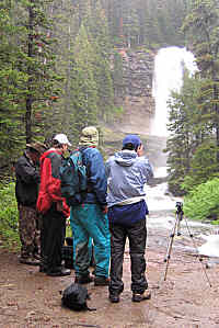 Group photo in the rain, Virginia Falls, Glacier National Park, Montana, U.S.