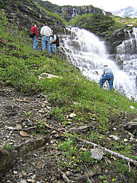 Difficult footing at Logan Creek Falls, Glacier National Park, Montana, U.S.