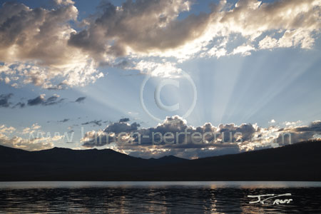 Sunset godbeams over Howe Ridge and Lake McDonald, Glacier National Park
