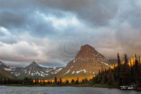 Pray Lake and Sinopah Mountain in a stormy sunrise, Glacier National Park, Montana, U.S.