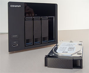 The NAS and one of its hard drive trays.
