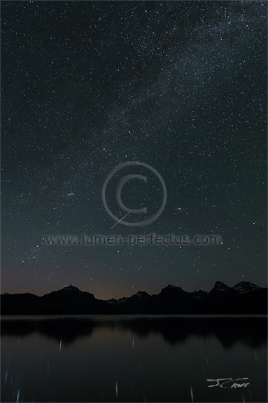 A starry night on the shore of Glacier National Park's Lake McDonald