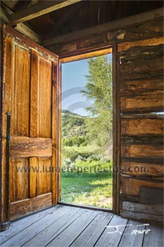 The view out the rear door of a Bannack cabin.