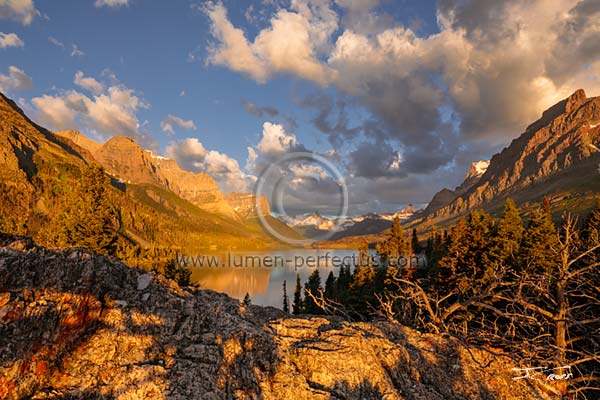Sunrise lights the mountains west of St. Mary Lake in Glacier National Park