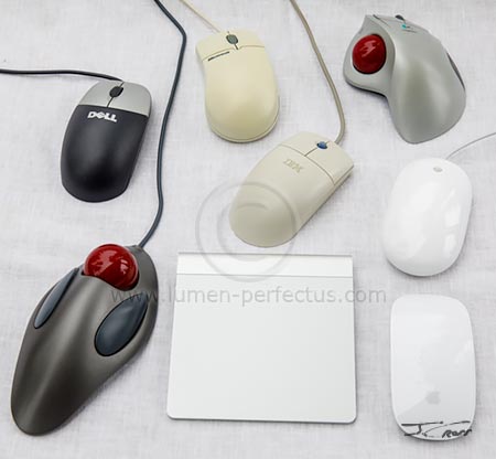 Various mice, trackballs, and a trackpad