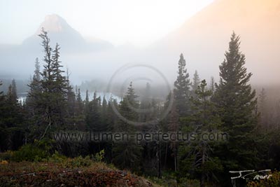 Fog obscures the mountains across Two Medicine Lake