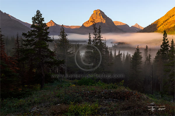 Sunrise on the mountains beyond Two Medicine Lake, Glacier National Park, MT