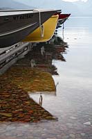 Rental boats reflected in Lake McDonald, Glacier National Park