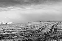 April snow on a plowed field in northwest Montana