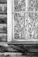 Lace curtain in an old log building, near Philipsburg, Montana, U.S.