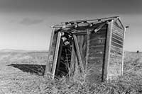 Crumbling outhouse in Ninepipe NWR, Montana, U.S.