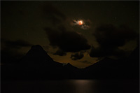 Lunar eclipse over Two Medicine Lake, Glacier National Park, Montana, U.S.