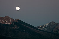 Full moon rising over the Mission Mountains, Montana, U.S.