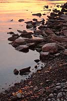 Sunrise on the rocky shore of Flathead Lake