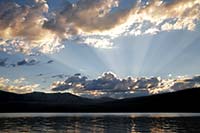Sunset godbeams over Howe Ridge and Lake McDonald, Glacier National Park, Montana, U.S.
