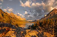 Sunrise lights the mountains west of St. Mary Lake in Glacier National Park, Montana, U.S.