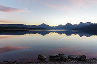 Clear July sky over Lake McDonald at sunrise, Glacier National Park, Montana, U.S.