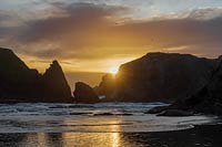 Stormy sunset, Elephant and Coquille rocks, Bandon Beach, Oregon, U.S..
