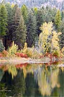 Fall color reflected in a small western Montana lake